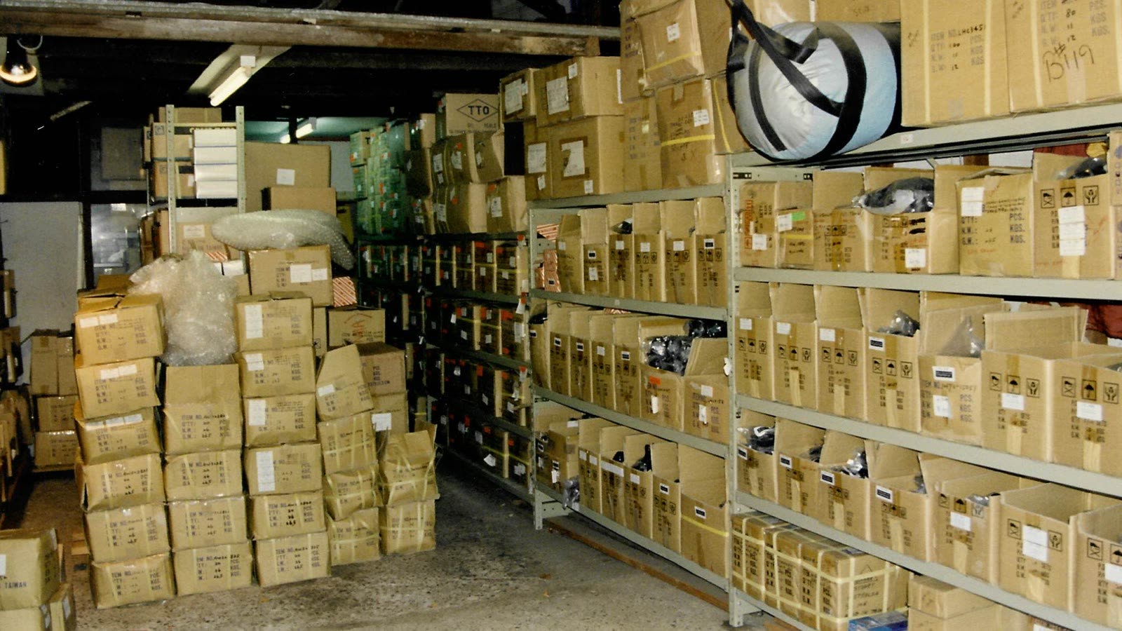The early stockroom, our garage packed floor to ceiling with boxed parts