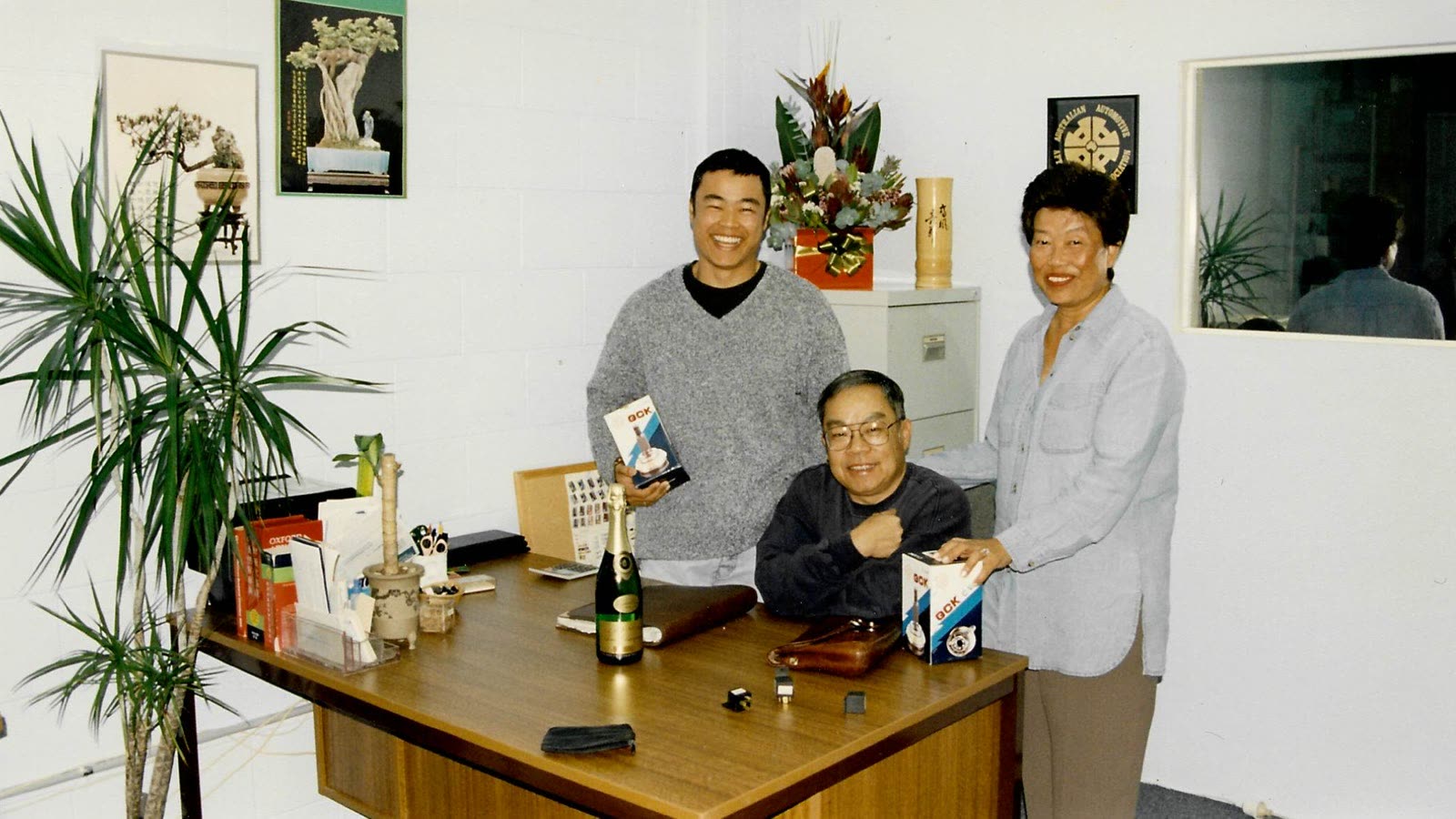 Boonma and Soune in the early days, with Vanh at the desk in the first office