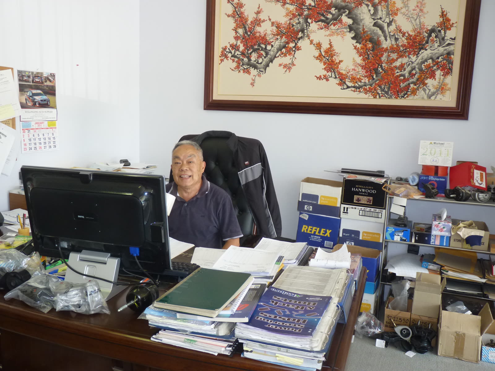 Soune at his desk, parts catalogues and samples never far away